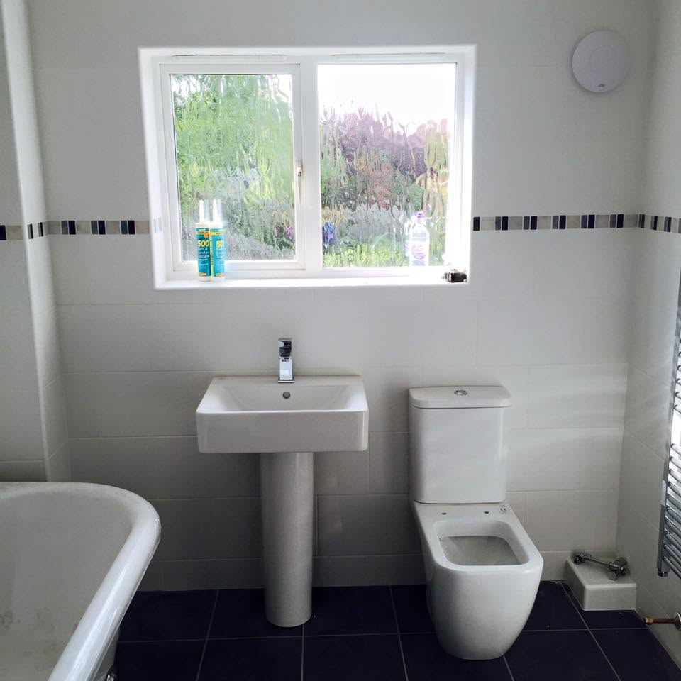 Modern family bathroom with freestanding bath