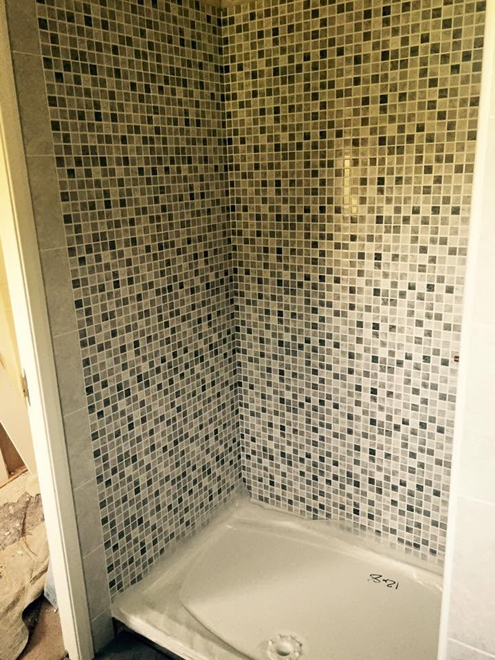 Mosaic tiled shower enclosure